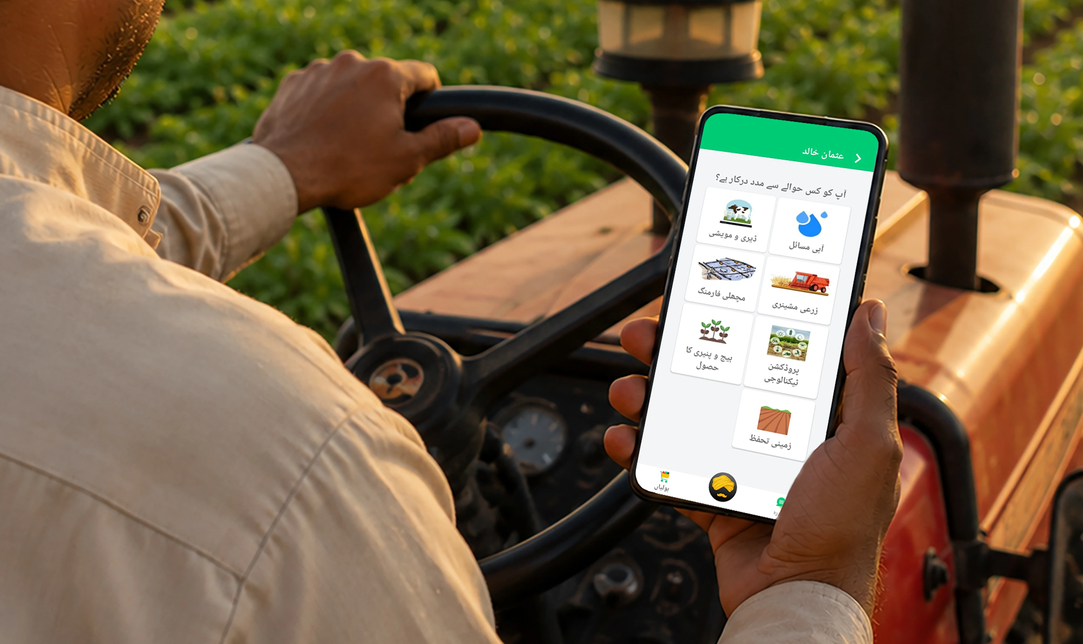 Farmer driving tractor viewing app